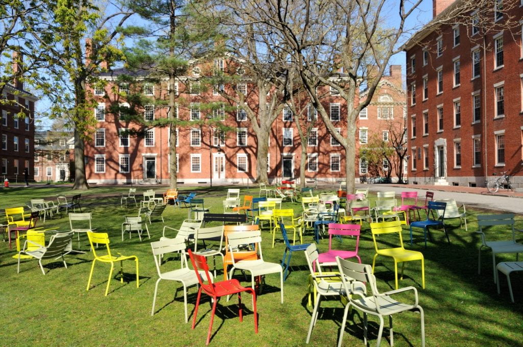 Colored chairs in Harvard Yard.